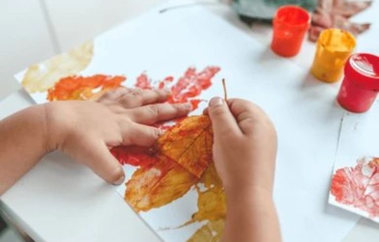 Kid doing Leaf Impressions